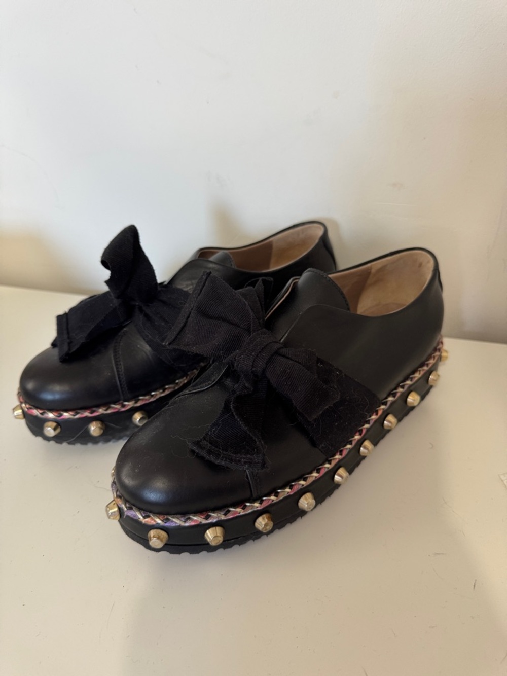 Black Leather Platform Slip-On Shoes with Bow and Stud Trim